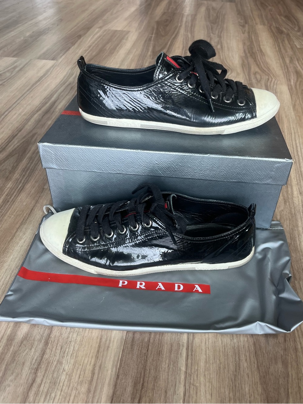 Prada women’s Patent Leather Low-Top Sneakers